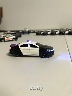 2013 FORD Taurus Black And White POLICE 1/64 With LED Lights Sold With Charger