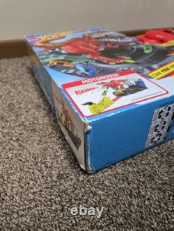 Hot Wheels T-Rex Rampage Playset & 164 Scale Vehicle Toy Car Track Set
