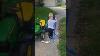 Little Boy Tows His Toy Car With His Tractor