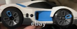White & Blue Toy Car Vehicle with Black Windows, Battery Compartment on Bottom