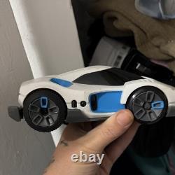 White & Blue Toy Car Vehicle with Black Windows, Battery Compartment on Bottom